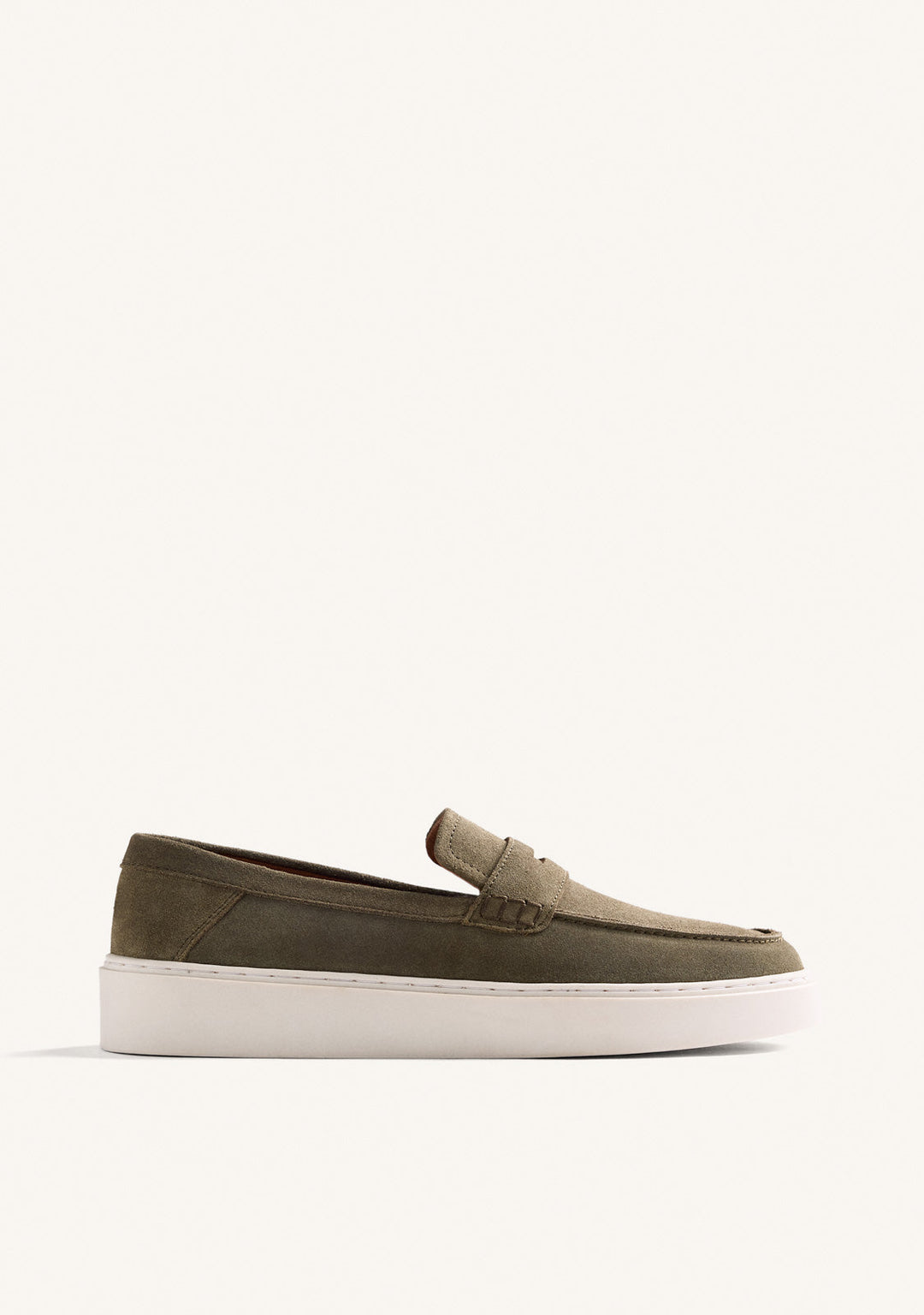 Green penny loafers with rounded moc toes and white platform soles
