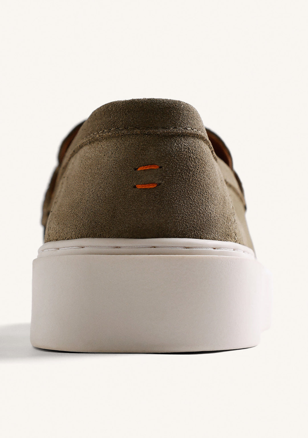 Green penny loafers with rounded moc toes and white platform soles
