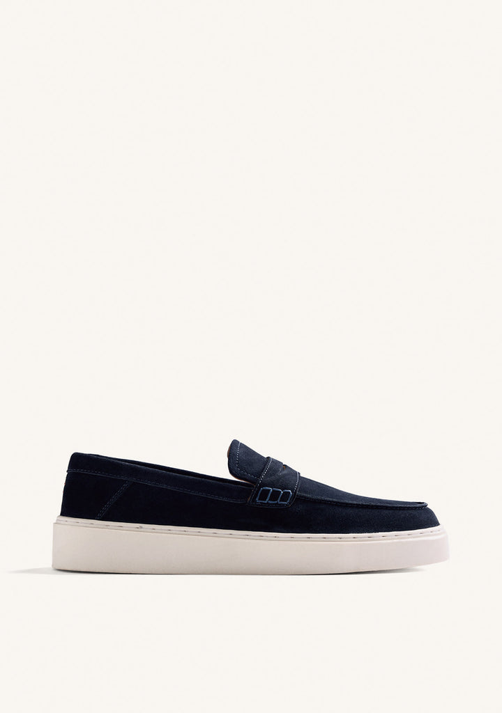 Navy penny loafers with moc toe stitching and light platform soles