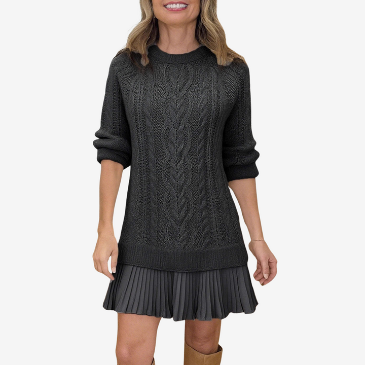 Women's cable knit dress with crew neck, long sleeves and pleated hem