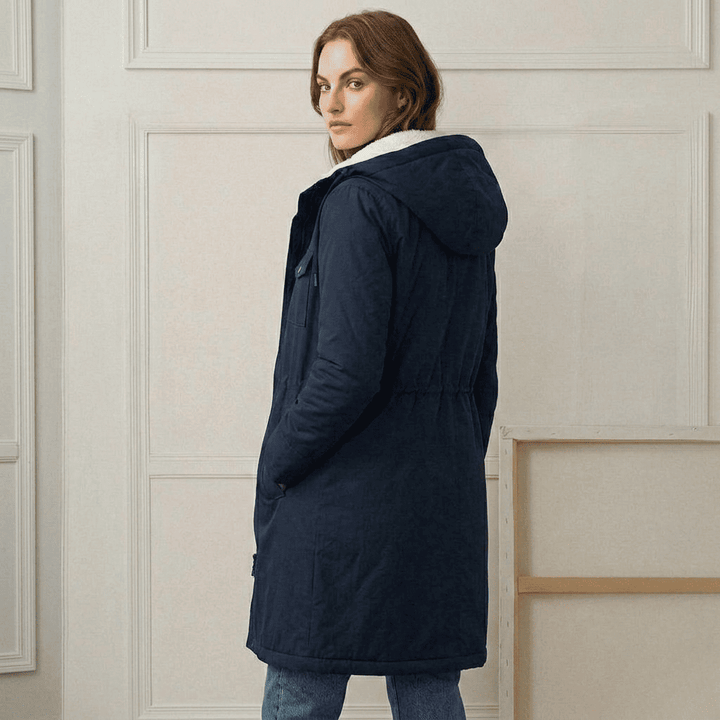 Women's long hooded parka with lined interior and flap pockets