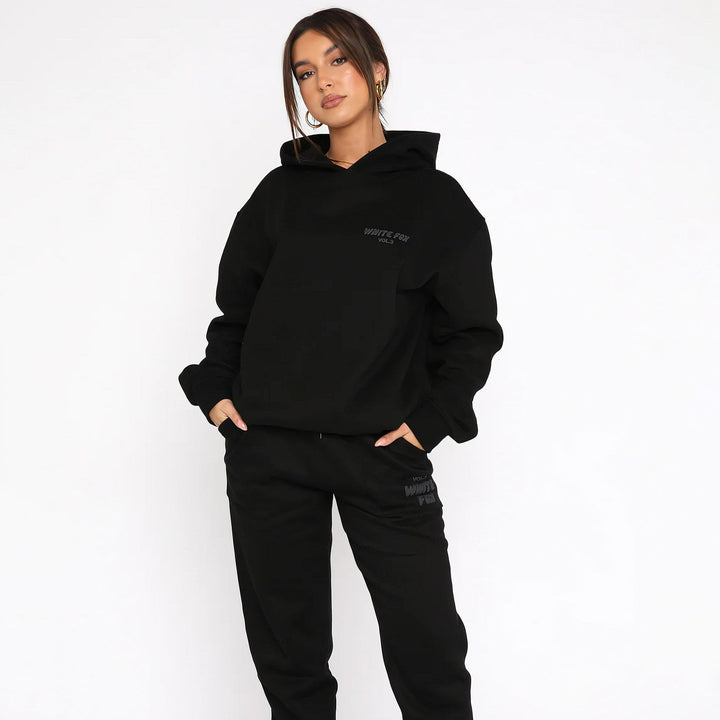 Women's hoodie and jogger tracksuit set with hood and pockets