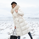 Women's longline quilted winter coat with fur-trim hood