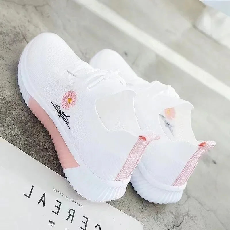 Women's textured lace-up sneakers with floral side detail and ridged soles