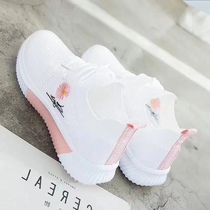Women's textured lace-up sneakers with floral side detail and ridged soles