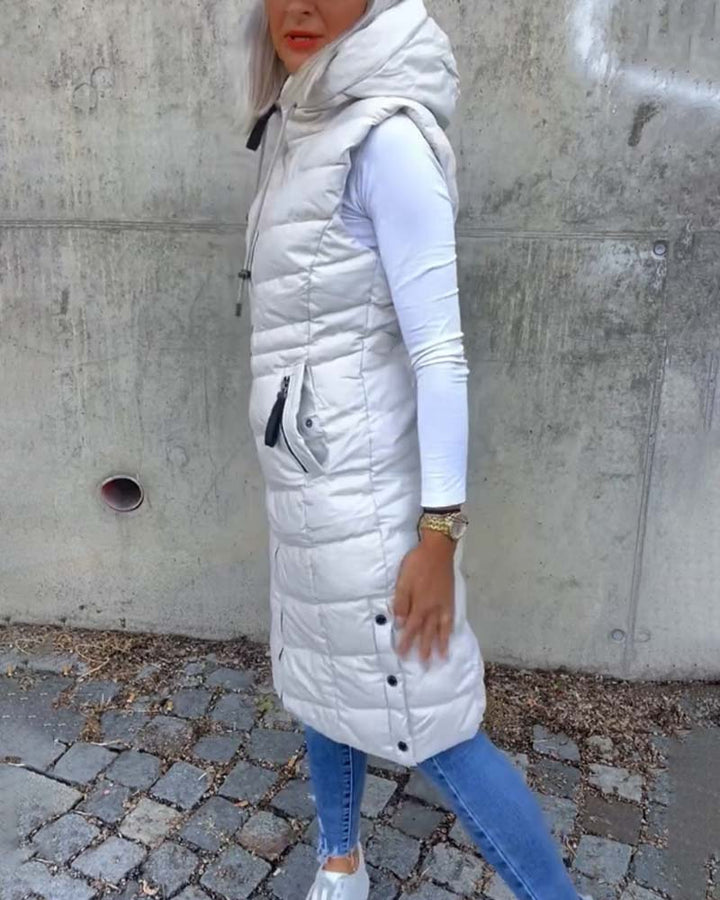 Women's white sleeveless quilted hooded longline vest with front zipper and zip pockets