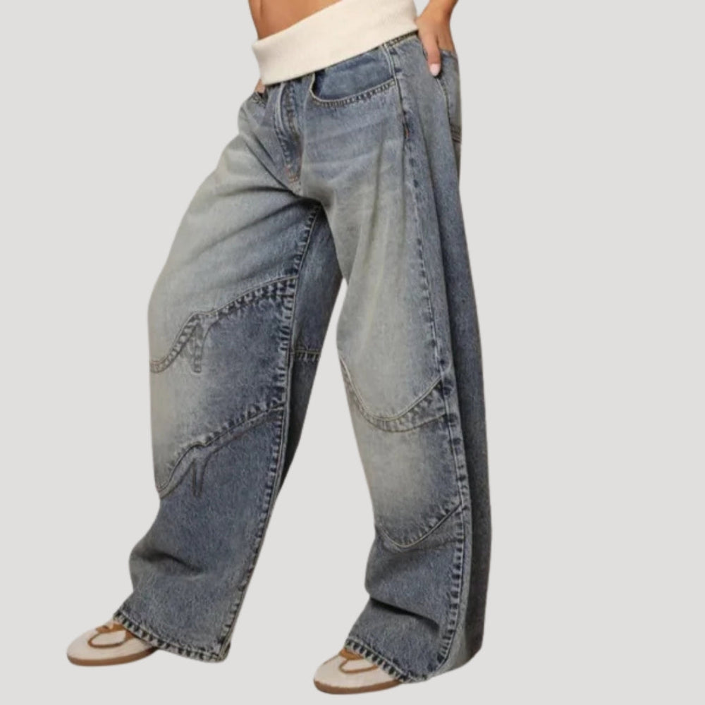 Women's light blue low-rise wide leg jeans with curved seam panels
