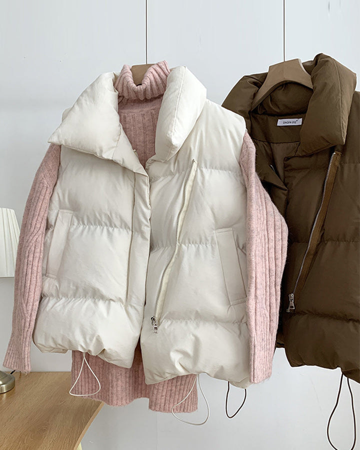 Sleeveless quilted puffer vest with stand collar, front zipper and side pockets