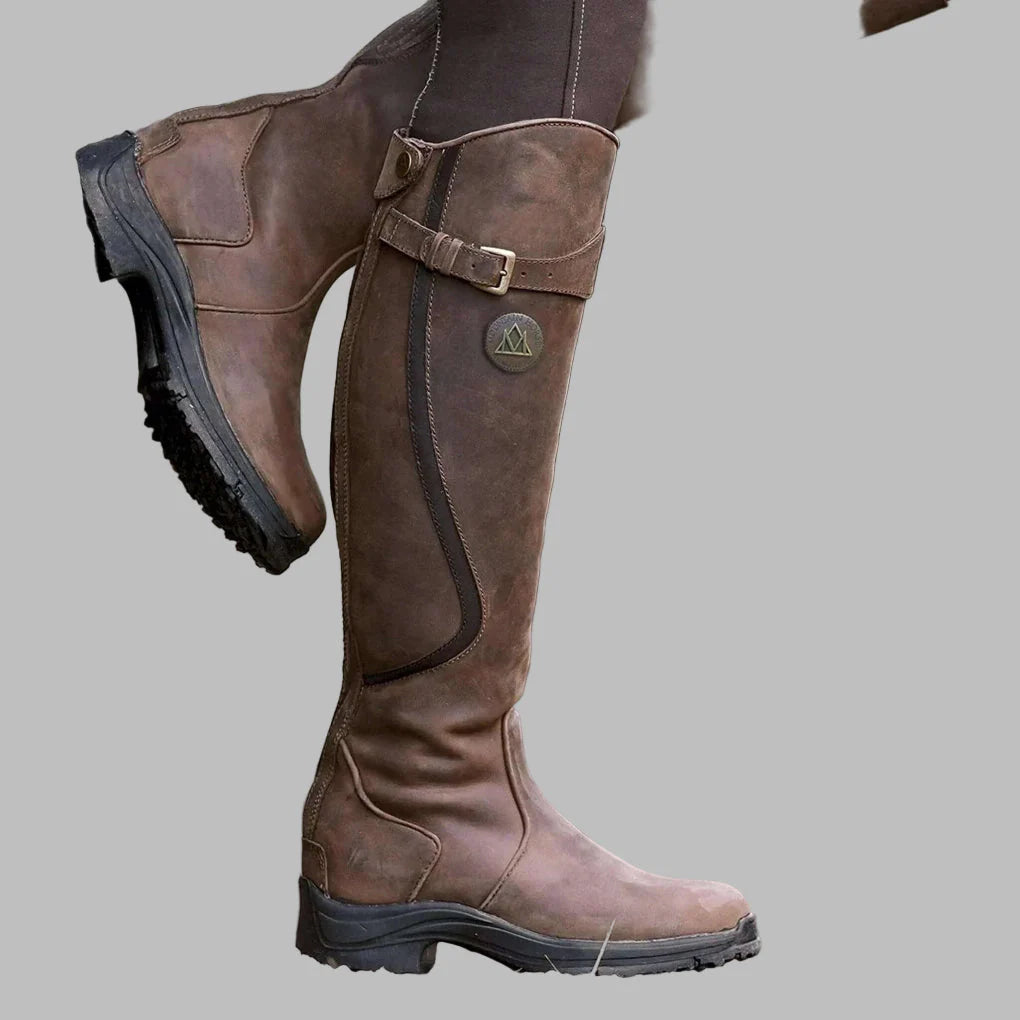 Women's tall riding boots with buckle strap and low heel