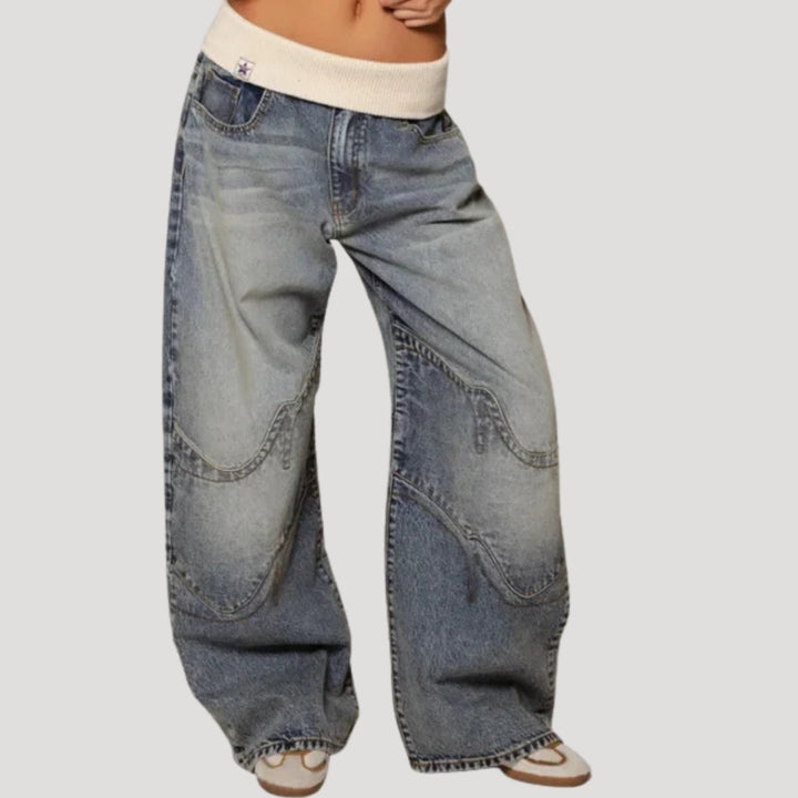Women's light blue low-rise wide leg jeans with curved seam panels