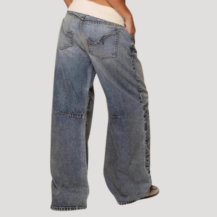 Women's light blue low-rise wide leg jeans with curved seam panels