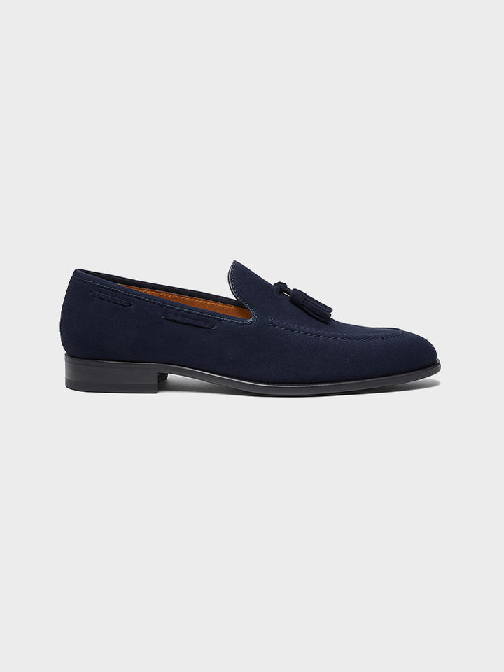 Men's navy tassel loafers with almond toes and low heels