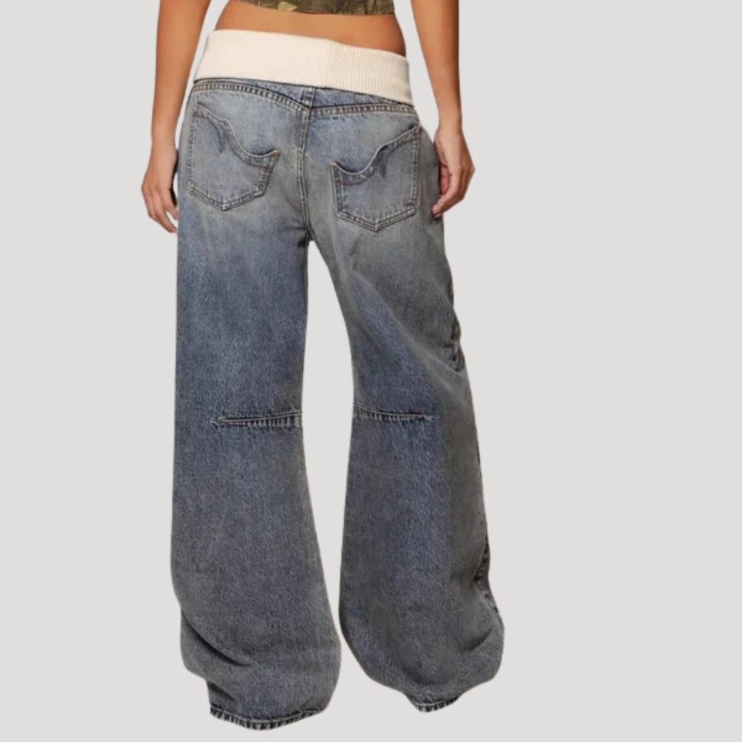Women's light blue low-rise wide leg jeans with curved seam panels