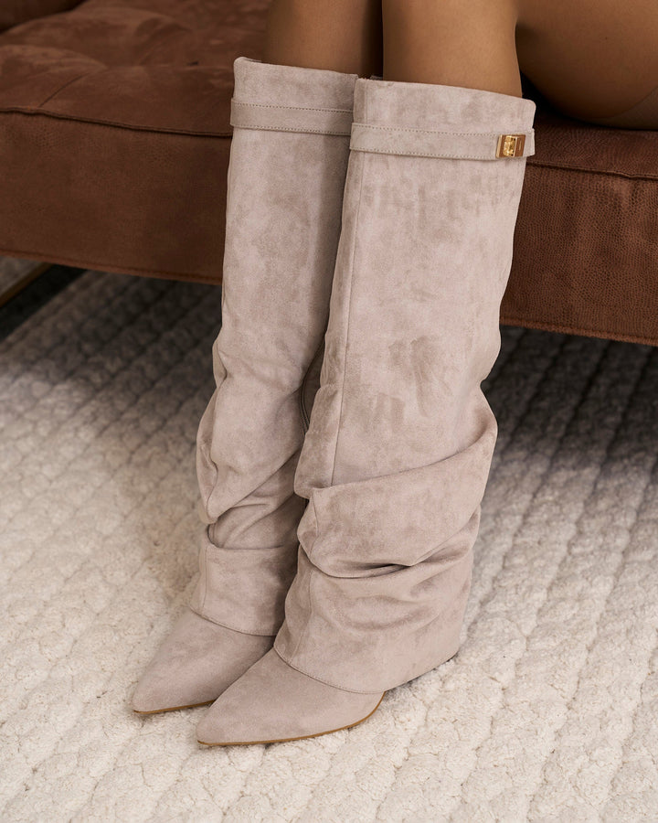 Women's taupe slouchy knee-high boots with pointed toes and buckle straps