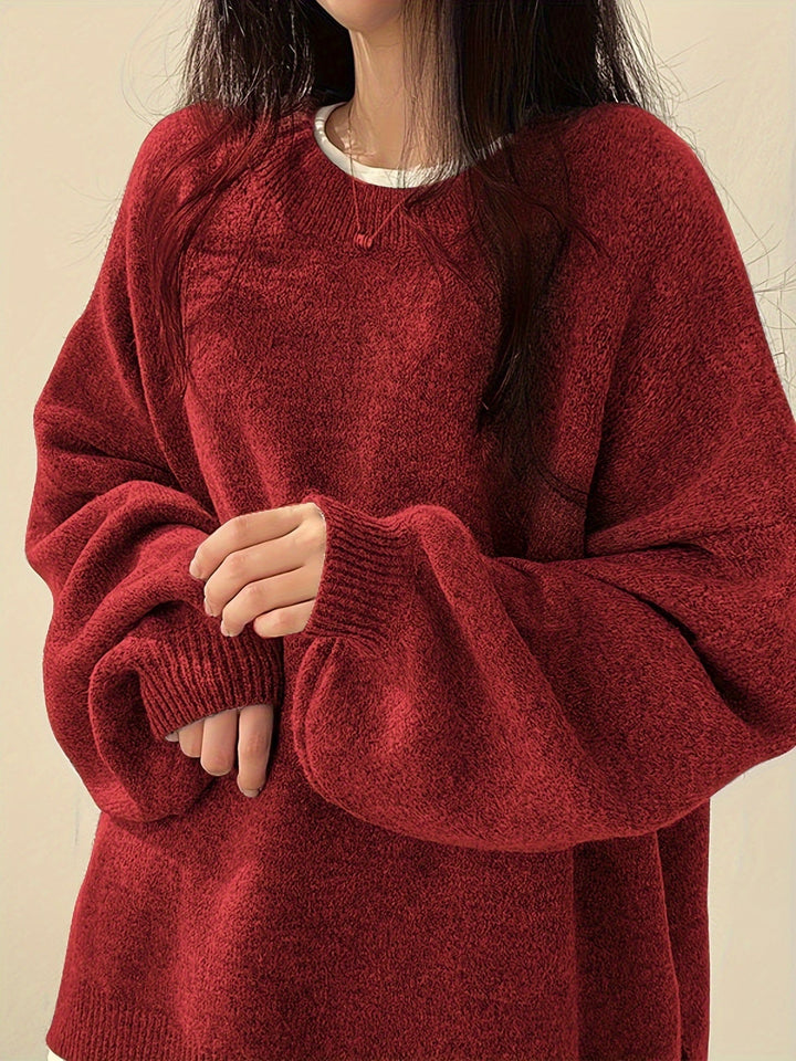 Women's loose crew neck jumper with long sleeves, ribbed trims and split hem