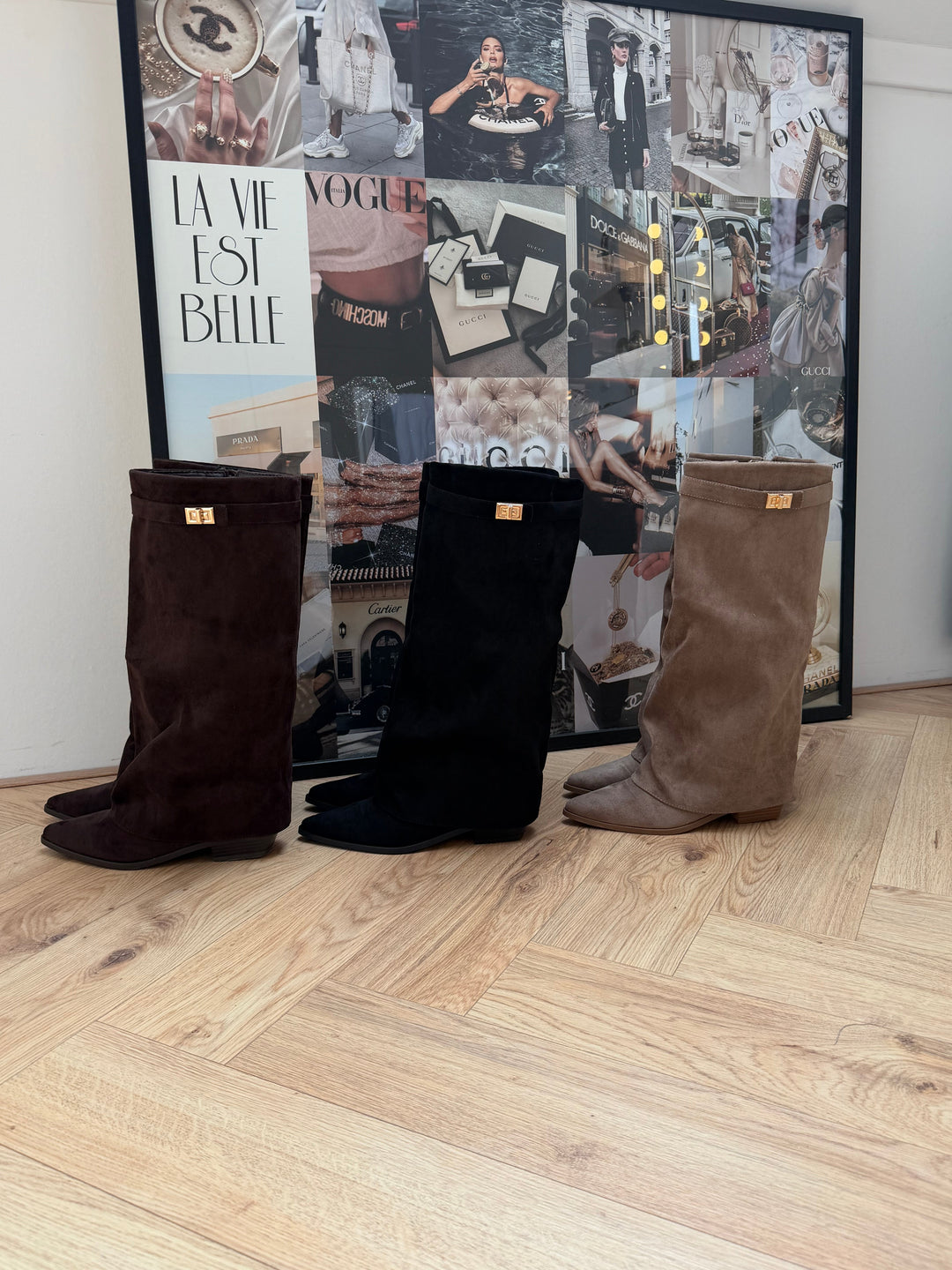 Women's brown knee-high boots with pointed toes, buckle straps and low block heels
