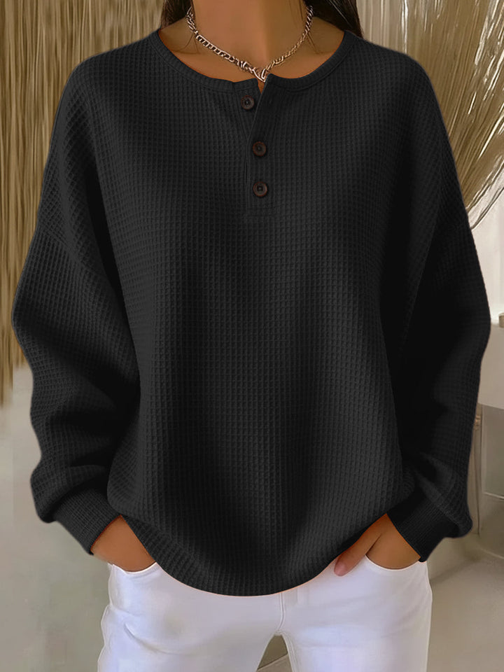 Women's waffle knit Henley top with long sleeves and button placket