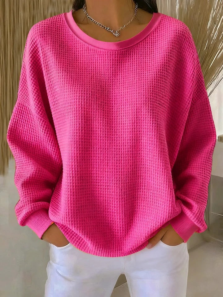 Women's textured crew neck sweater with long sleeves and ribbed cuffs