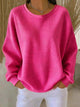 Women's textured crew neck sweater with long sleeves and ribbed cuffs