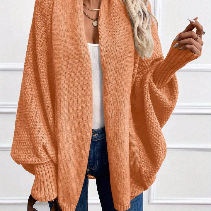 Women's draped open-front cardigan with shawl collar and ribbed cuffs