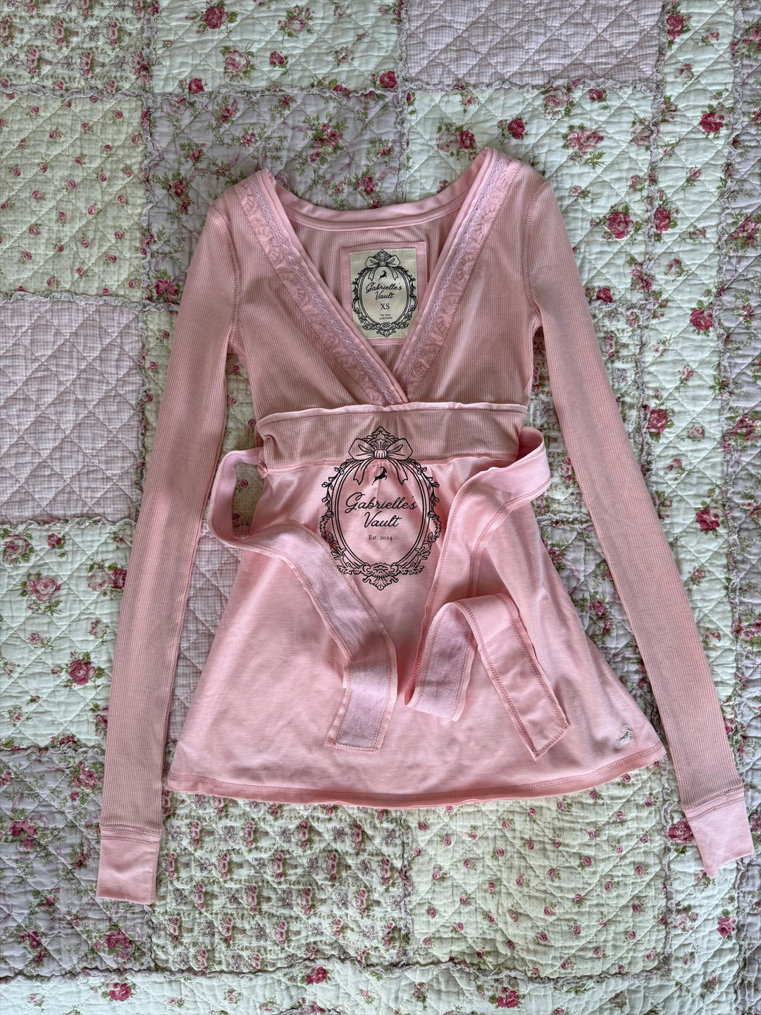 Women's ribbed wrap babydoll top with V-neckline and long sleeves