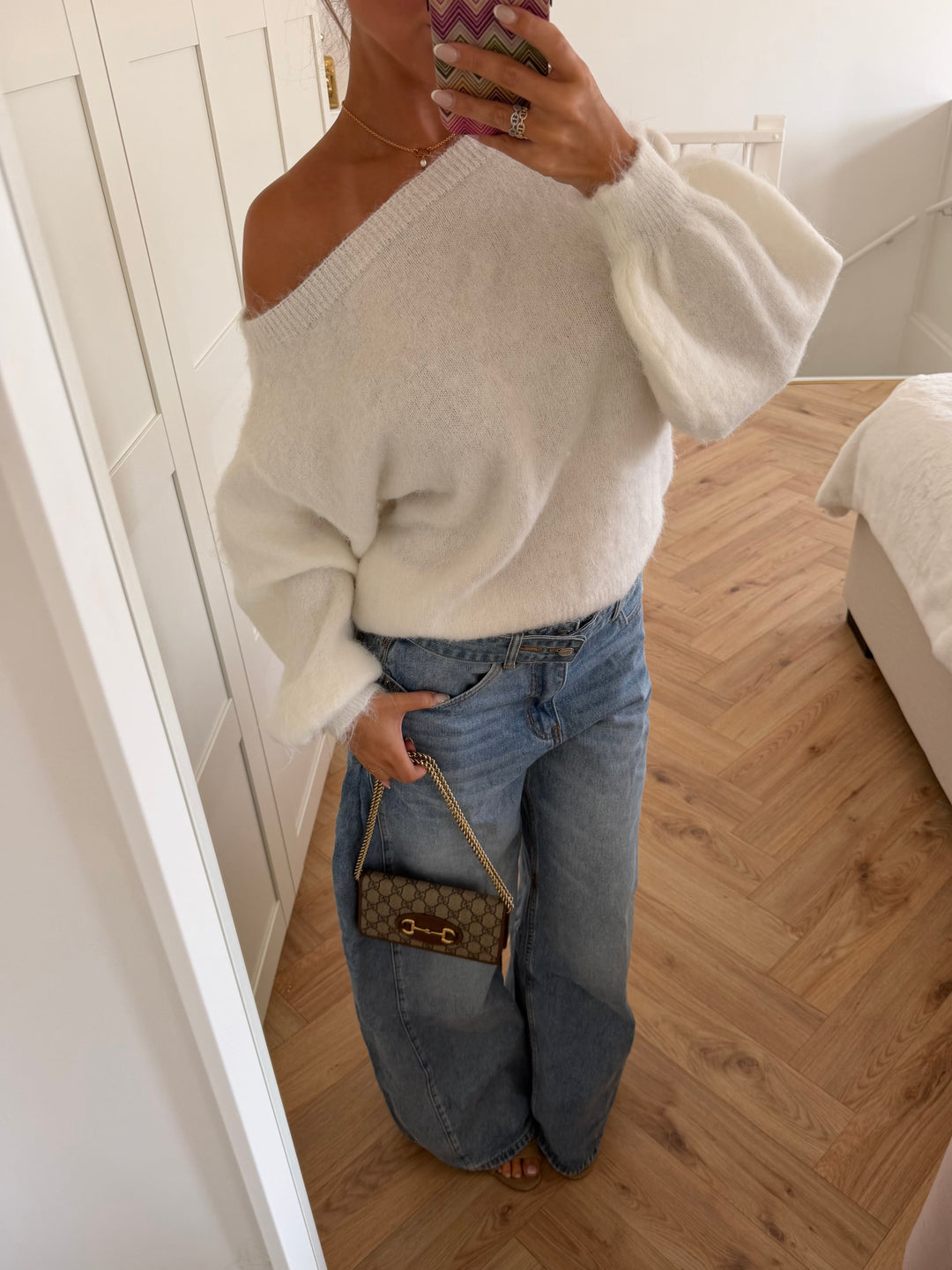 Women's white off-shoulder sweater with long sleeves and ribbed trims