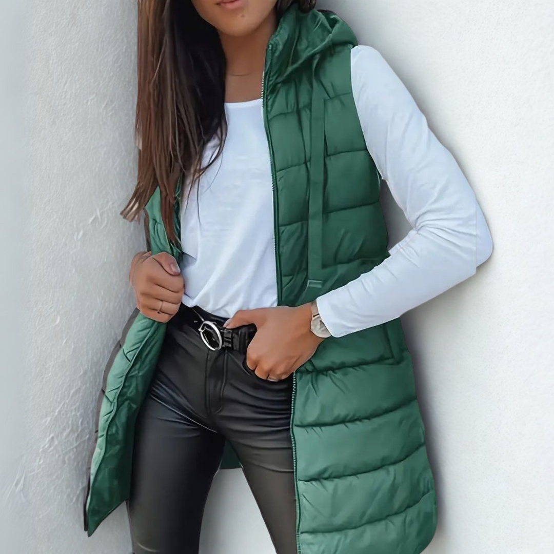 Women's long sleeveless hooded quilted puffer vest with zip front
