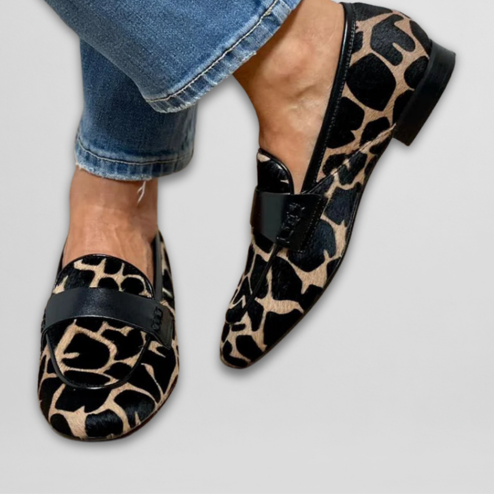 Women's black animal print slip-on loafers with low block heels