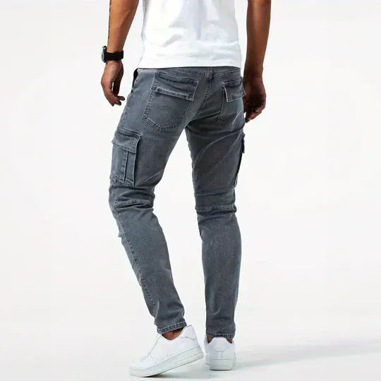 Men's tapered cargo jeans with multiple thigh pockets and panel detailing