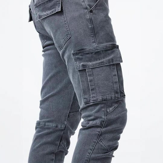 Men's tapered cargo jeans with multiple thigh pockets and panel detailing