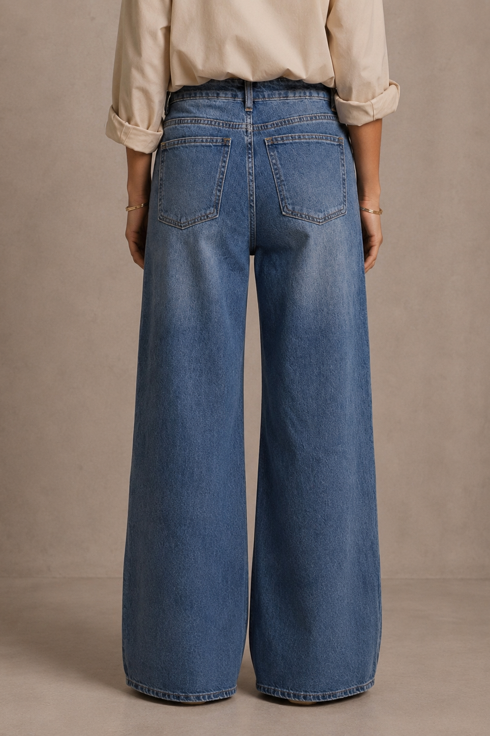 Women's blue wide leg jeans with high-rise waist and braided pocket trim