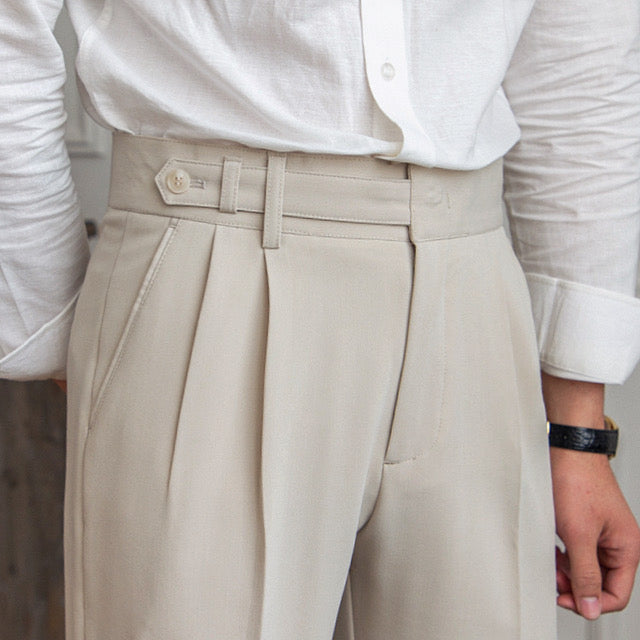 High-waisted pleated straight-leg trousers with belt