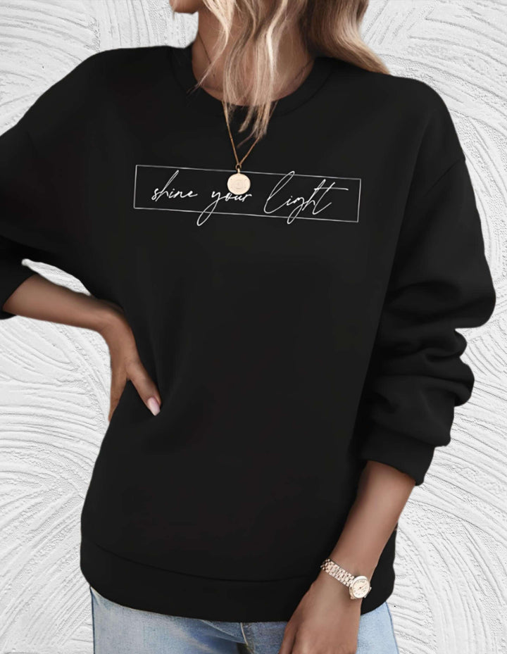 Women's crew-neck sweatshirt with framed shine your light text print