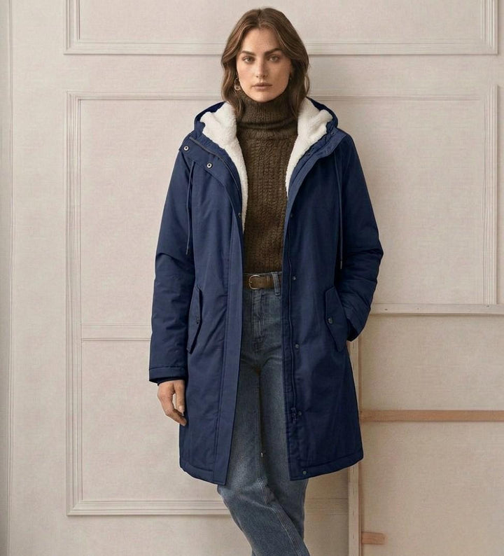 Women's long hooded parka with lined interior and flap pockets