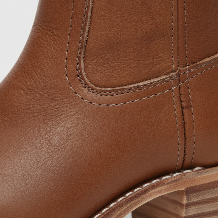 Women's knee-high boots with block heels and stitched panel detail