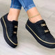 Women's low-cut sneakers with gold-tone trim and platform soles
