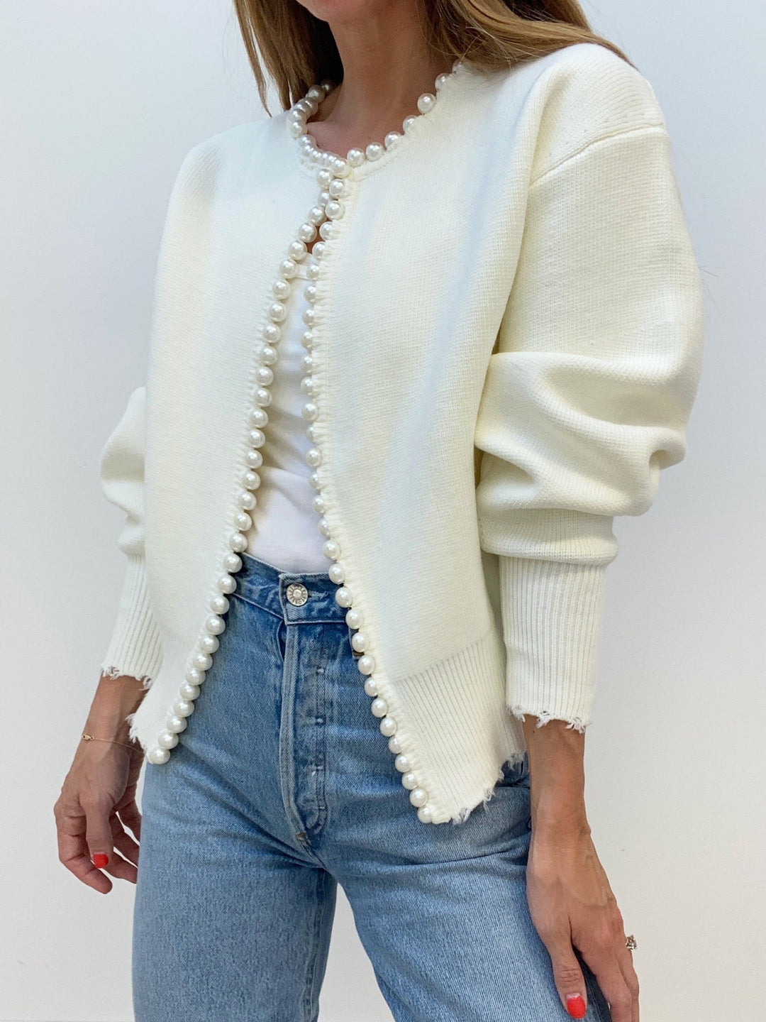 Women's open-front knit cardigan with pearl-style trim and long sleeves