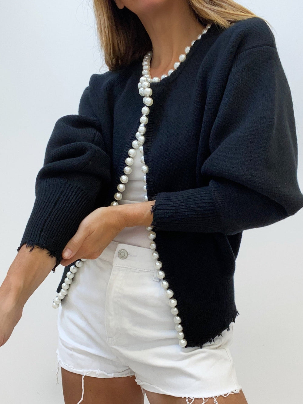 Women's open-front knit cardigan with pearl-style trim and long sleeves