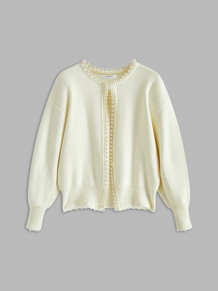 Women's open-front knit cardigan with pearl-style trim and long sleeves