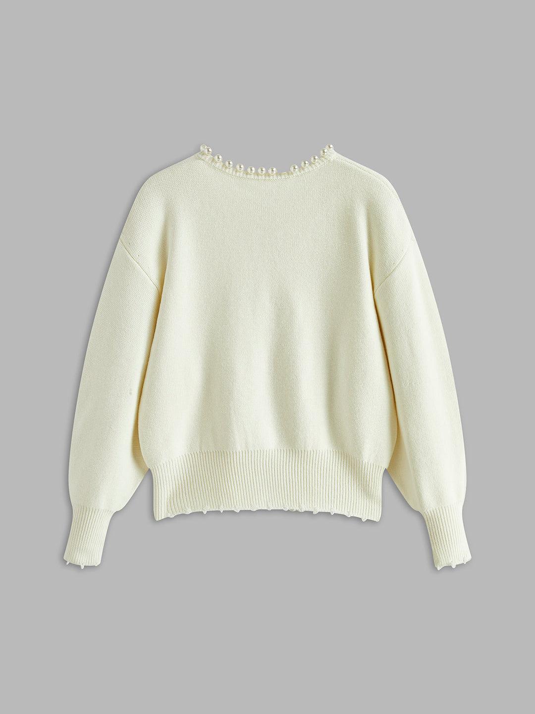 Women's open-front knit cardigan with pearl-style trim and long sleeves