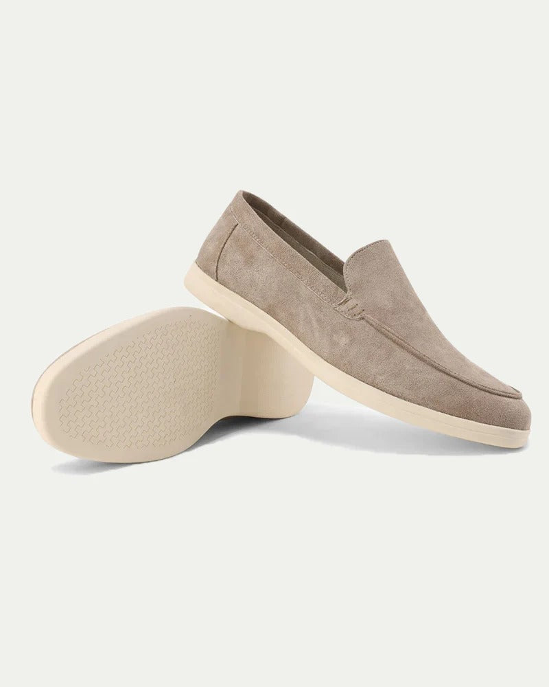 Men's slip-on loafers with stitched moc toe detailing and flat light-coloured soles