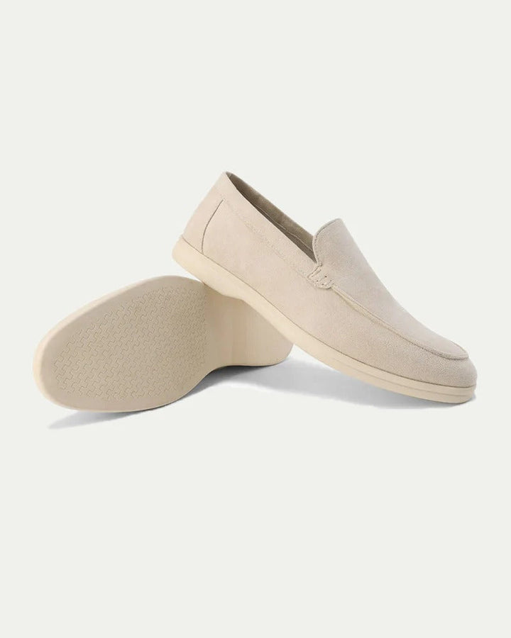 Men's slip-on loafers with stitched moc toe detailing and flat light-coloured soles