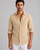 Men's long sleeve button-front shirt with pointed collar and curved hem