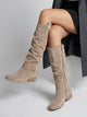Women's knee high slouchy boots with buckle detail and low heel
