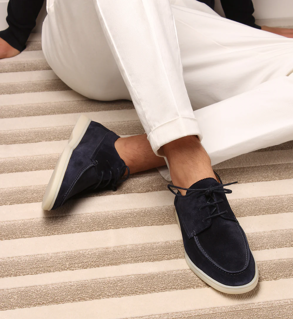 Men's lace-up boat shoes with moc toe stitching and flat sole