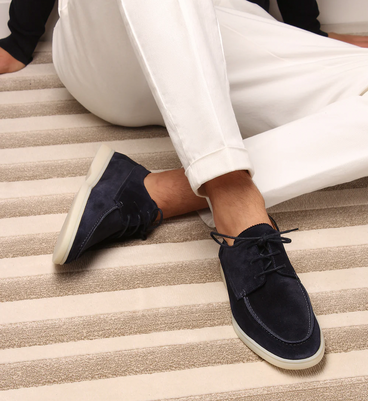 Men's lace-up boat shoes with moc toe stitching and flat sole