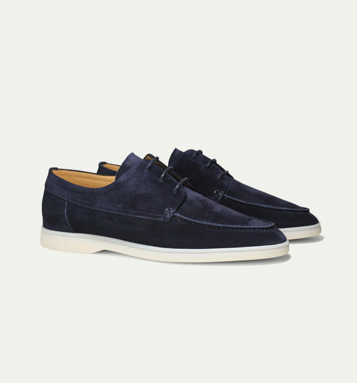 Men's lace-up boat shoes with moc toe stitching and flat sole