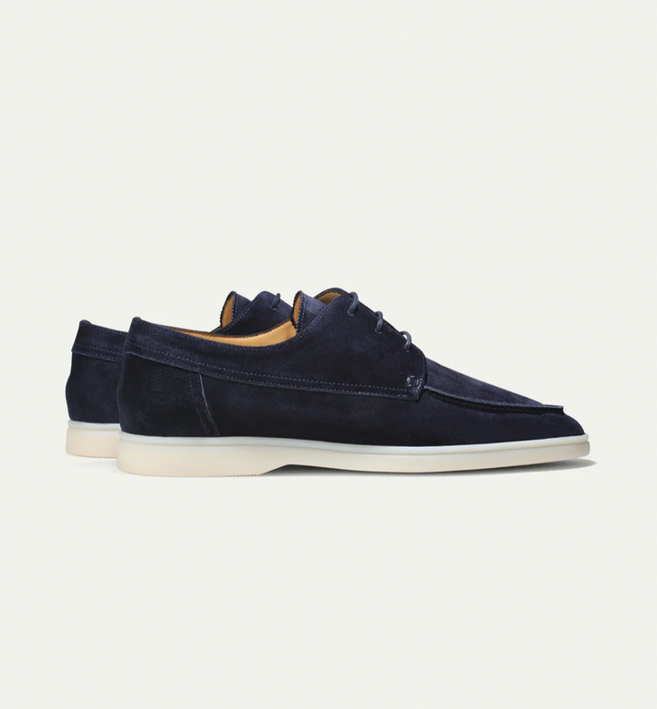 Men's lace-up boat shoes with moc toe stitching and flat sole