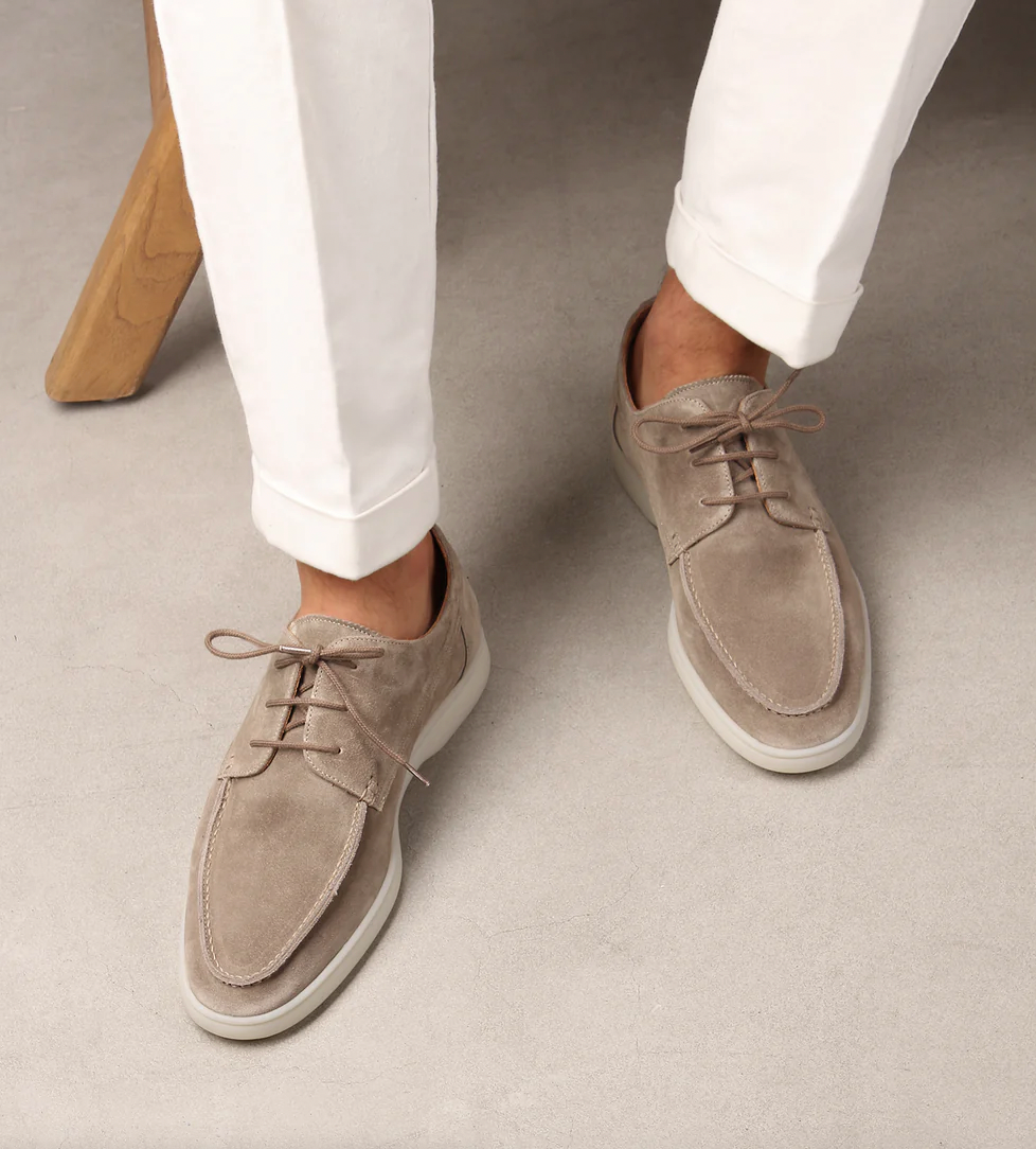 Men's lace-up boat shoes with moc toe stitching and flat sole