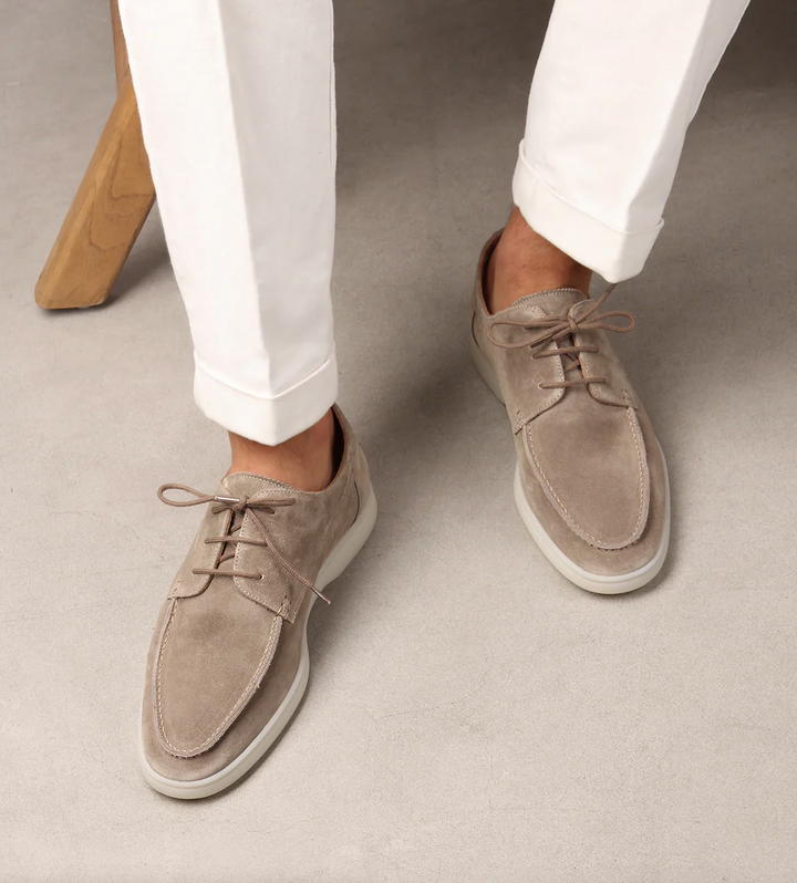 Men's lace-up boat shoes with moc toe stitching and flat sole